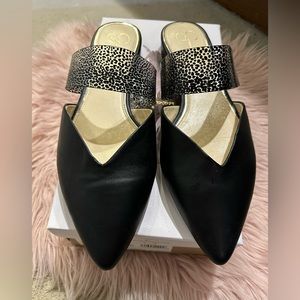 Sleek black leather mules